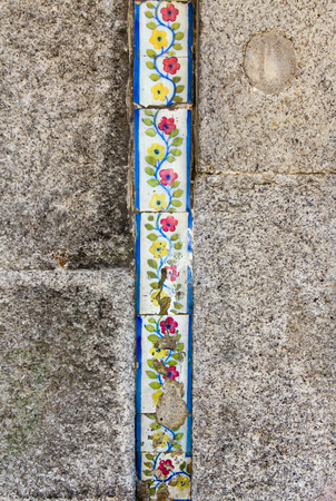 Traditional decorative tiles on facade of old house, Porto, Portugalの写真素材