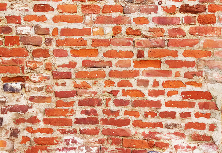 Red old brick wal, texture grunge backgroundの写真素材