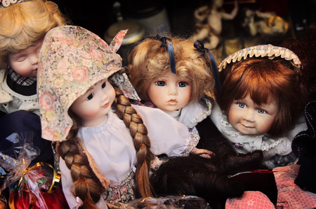 Beautiful vintage ceramic dolls at marketの写真素材