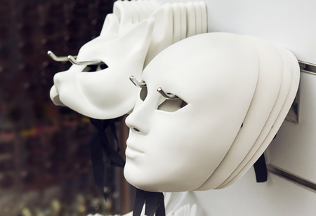 White Venice masks on the wallの写真素材