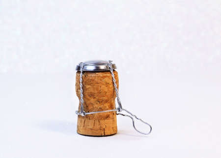 Champagne cork with white snowy bokeh with text space for congratulations.の写真素材