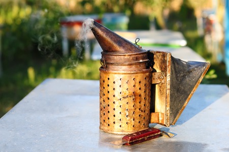 Old bee smoker. Beekeeping tool. Apiaryの写真素材