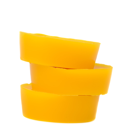Pieces of natural beeswax are isolated on a white background. Beekeeping products. Apitherapy.の写真素材