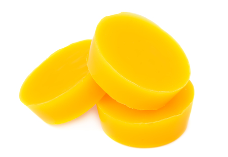 Pieces of natural beeswax are isolated on a white background. Beekeeping products. Apitherapy.の写真素材