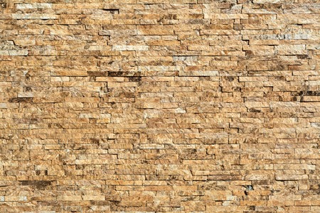 Stone wall of natural stones in different sizes. The facade of the houseの写真素材