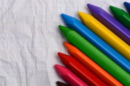 Colored pencils on a piece of paper with free space for text.の写真素材