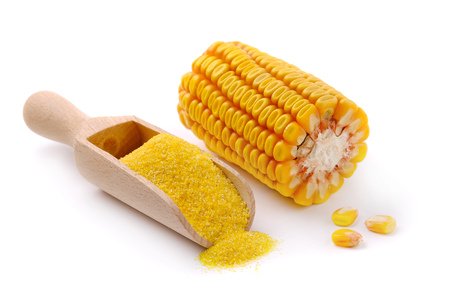 wooden scoop with corn flour on white background.の写真素材
