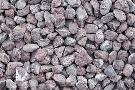 Background made of a closeup of a pile of pebbles.の写真素材