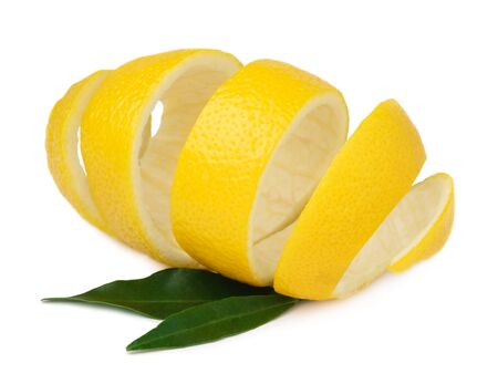 Lemon peel with green lemon leaves isolated on a white background. Use of lemon peel in cooking and medicine.の写真素材