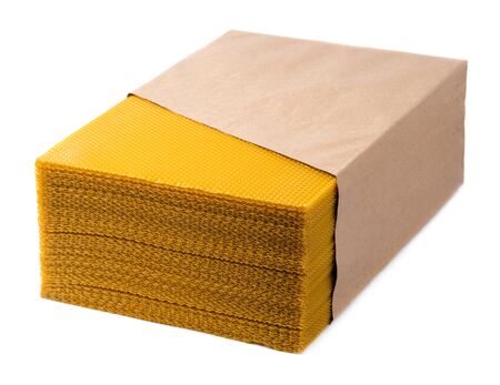 Beeswax. Wax base for honey bee rebuilding on a white background. Honeycombs.の写真素材