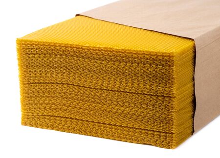 Beeswax. Wax base for honey bee rebuilding on a white background. Honeycombs.の写真素材