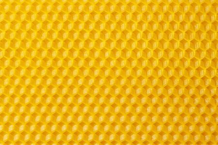 Beeswax. Wax base for honey bee rebuilding. Honeycomb. Natural honeycomb bee background.の写真素材