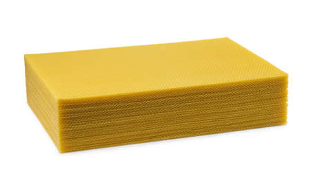 Beeswax. Wax base for honey bee rebuilding on a white background. Honeycombs.の写真素材