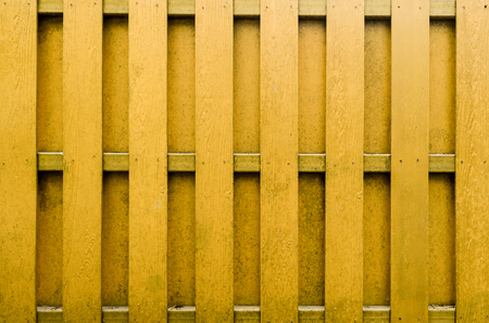 yellow wooden fence background.の写真素材