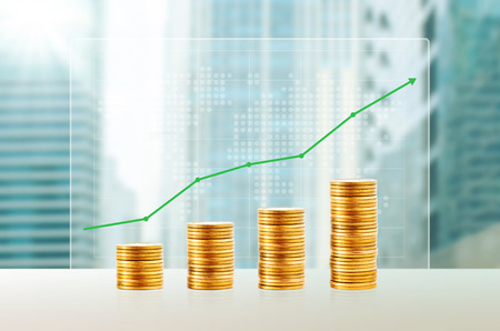 Success in business concept. Gold coin stacks. Finance growth up with world map and cityscape...