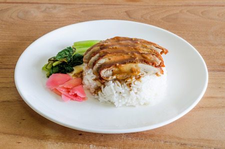 Rice with roast duck on wooden table. thai food.の写真素材
