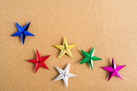 Christmas background. Colorful stars on cork board. Abstract background.の写真素材