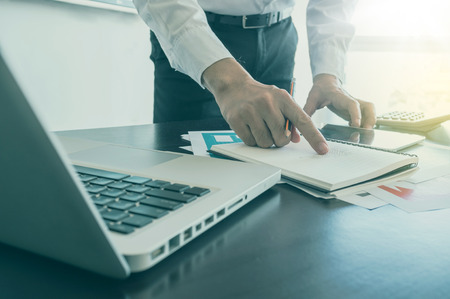 Business, office concept. businessman working with digital tablet and laptop with financial business...