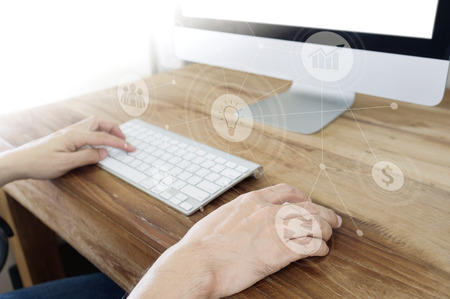 Business, office concept. Man's hands using computer with social connect icons