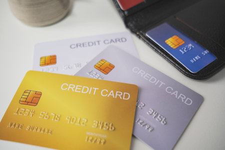 Pile of credit cards on white background. Cashless technology and credit card payment concept, via internet for convenience of transaction.の写真素材