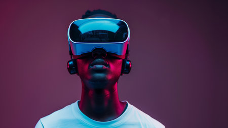 Portrait of man wearing a VR headset playing a video game. Studio background with vibrant lights. Future technology concept. Generative AI.の素材