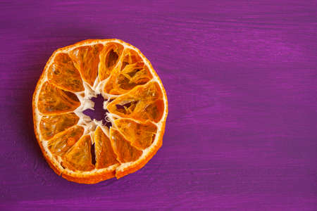 Dried oranges. Dried citruses on wooden background frame template. Copy spaceの写真素材