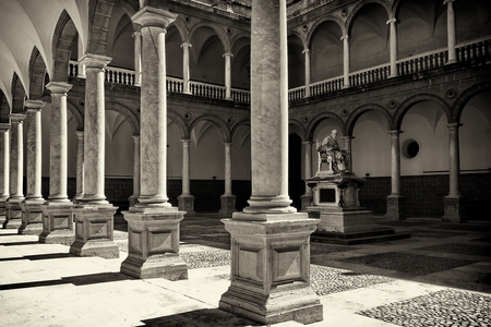July 31, 2013, Valencia, the courtyard of the Museum of the Patriarch with the arches and pillars in the center of the sculpture of the Patriarch Juan de Riberaのeditorial素材
