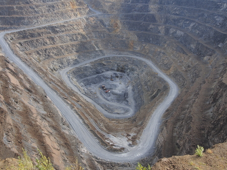 Construction equipment on the bottom of the quarryの写真素材