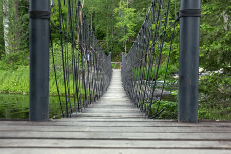 Suspend wooden bridge in perspective. Ruskeala, Karelia, Russiaの写真素材