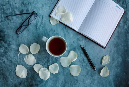 Notebook and pen on the table. Working environmentの写真素材