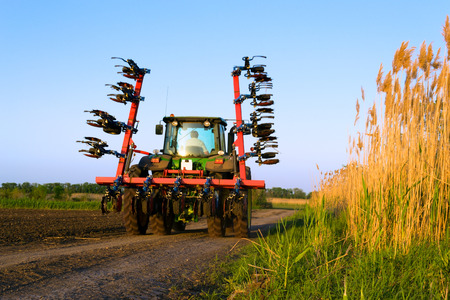 Working tractor in a field