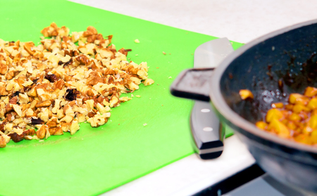 Preparation of a filling for a bun. Roasting apples in a frying panの写真素材