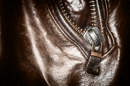 Leather jacket. Zip pocket leather jacket brown color. The closeups. Bright surface zipper. The texture of leather. Pocket in clothing.の写真素材