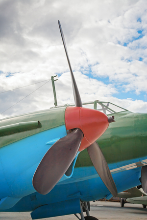 A propeller. The propeller blades are painted black. The blue plane is parked. Air car ready to take off. Clear blue sky waiting for an airplane.の写真素材