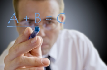 Businessman writing on the screenの写真素材