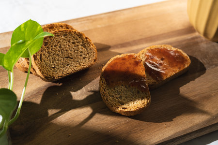 Close up view of tasty breakfast of toasts with jam on wooden board.の写真素材