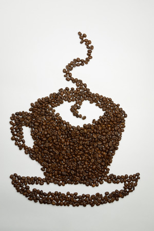 Cup with coffee, built of natural coffee beansの写真素材