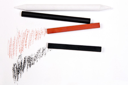 Assorted Art Tools. Pencils, eraser, stamp, chalk of sanguine and charcoal. Isolated over white background.の写真素材