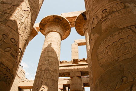 Ancient ruins of Karnak temple in Egypt. Close up view of the columns covered in egyptian antique hieroglyphs.の写真素材