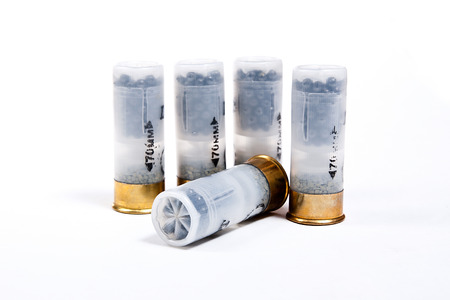 Four cartridges for hunting rifle isolated on white background.