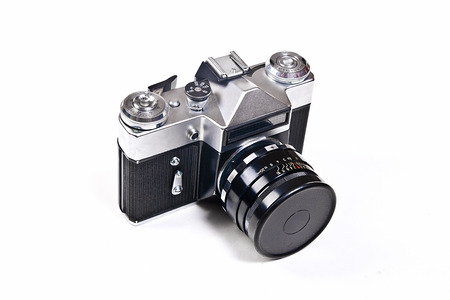 Range finder photo camera with lens. Classic black manual film camera isolated on white background.