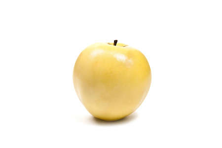 Single fresh yellow apple. Isolated on white background.の写真素材