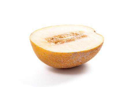 Half ripe juicy melon tropical fruit at summer time isolated on a white backgroundの写真素材