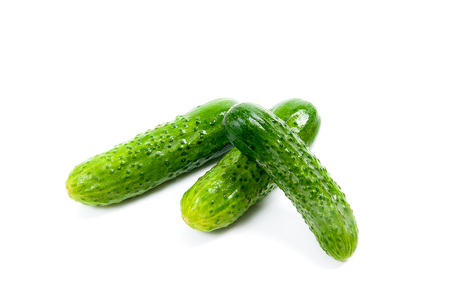 Fresh green cucumber with water drops isolated on the white backgroundの写真素材