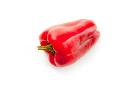 Whole red bell pepper (capsicum) known as sweet bell pepper, paprika isolated on white background with clipping path.の写真素材