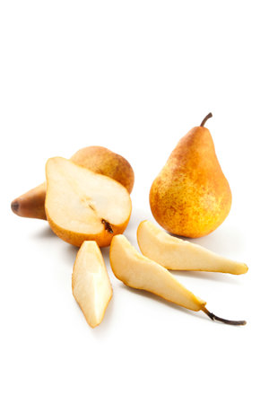 Two whole, half and slices of ripe juicy pear fruit with soft shadow isolated on white background with clipping path.の写真素材