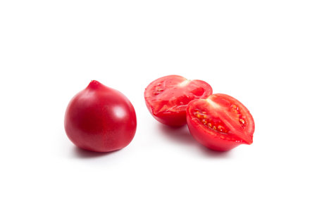 Whole and half of ripe juicy pink tomato with soft shadow isolated on white background. Vegetables collection on white.の写真素材