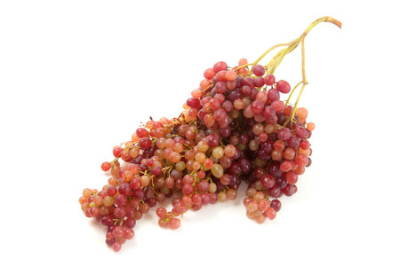 Bunch of pink wine grapes with soft shadow isolated on white background.の写真素材