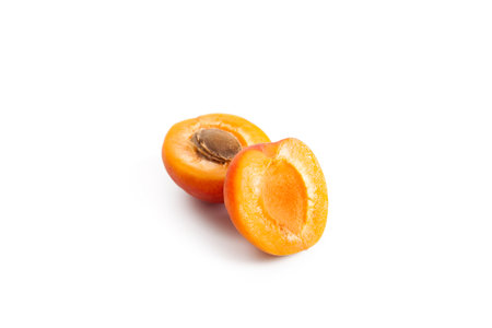 Half juicy apricot isolated on white background.の写真素材