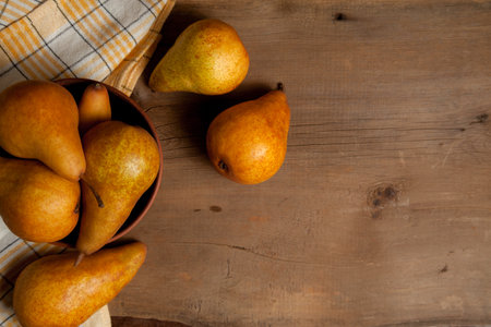 Fruit background image. Ripe juicy pear fruits on vintage wooden background.の写真素材